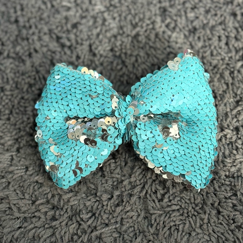 NWOT blue and silver sequined child’s bow